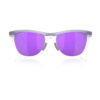 عینک آفتابی اوکلی Frogskins Hybrid – لنز Prizm Violet فریم Matte Trans Lilac Clear